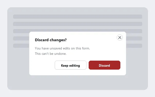 A "Discard changes?" modal dialog centered over a dimmed page, with body text explaining the consequence, context-specific "Keep editing"/"Discard" buttons, and a close button inside the dialog's own top-right corner